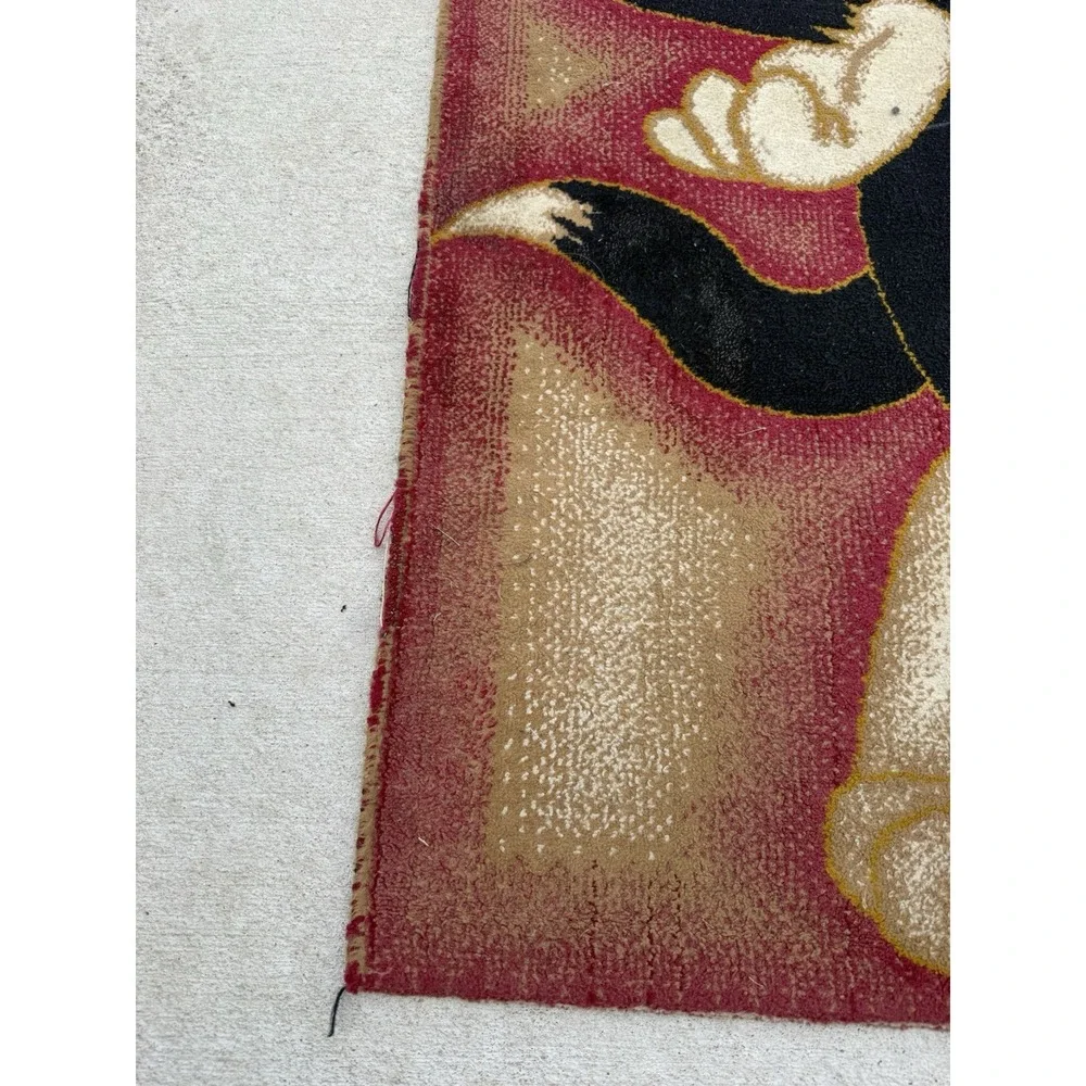 Vintage rug featuring Tom holding Jerry 64x42